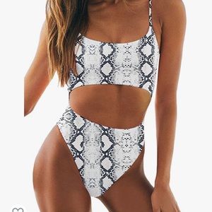 Size small cut out one piece swim suit. Snake skin
